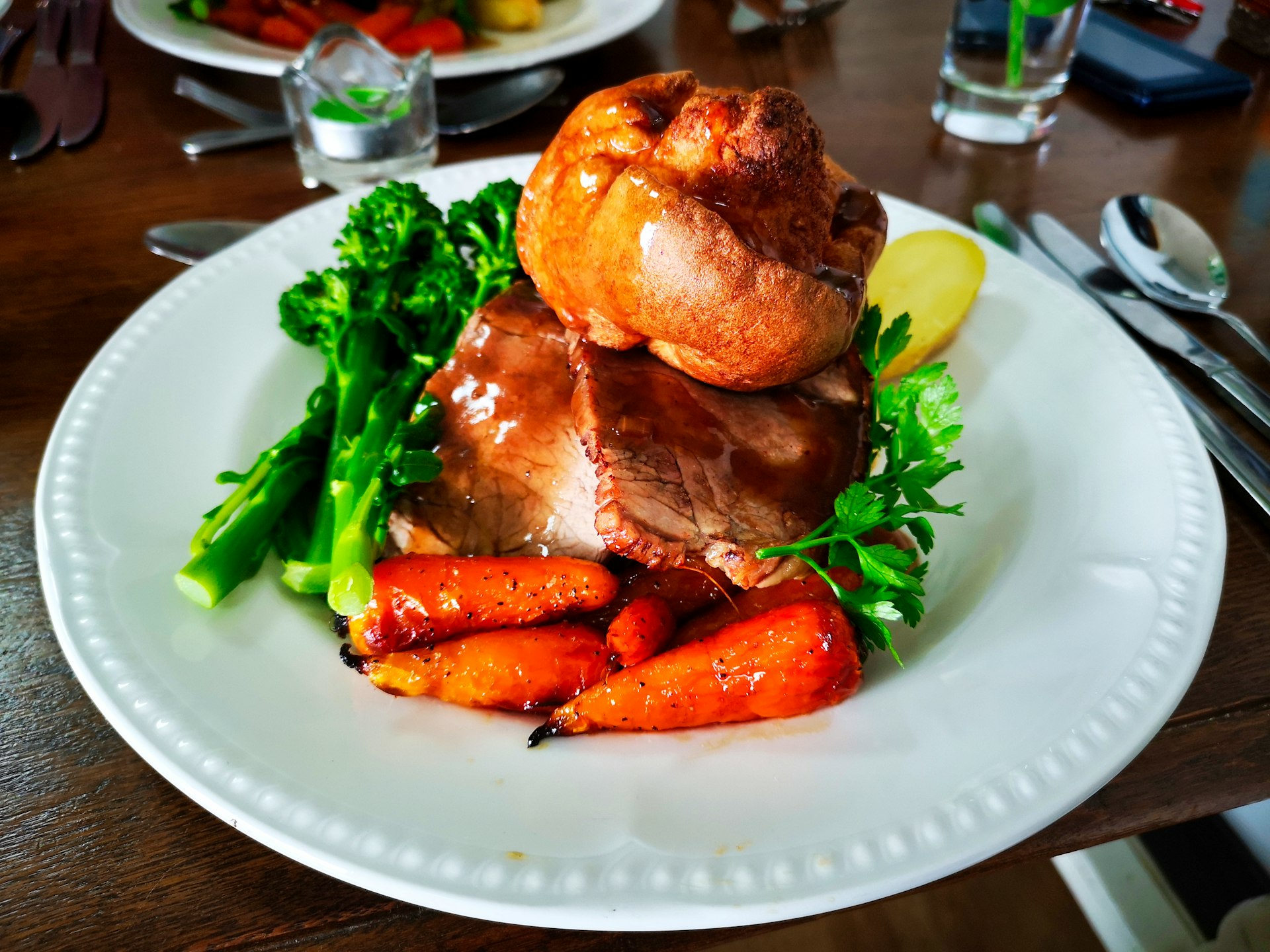 a white plate topped with meat and veggies